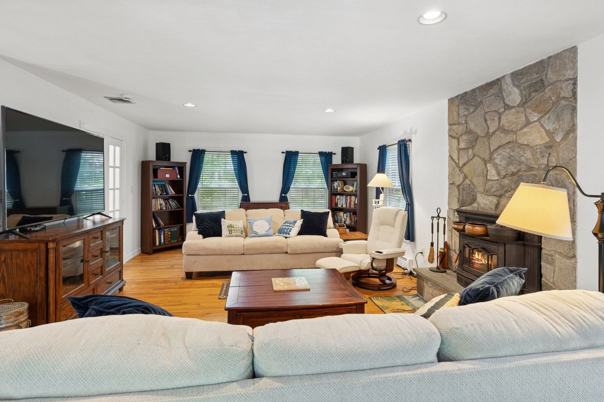 Fireplace, Interior, Living room, Recessed Lighting, Stone Walls, Wood Texture Flooring