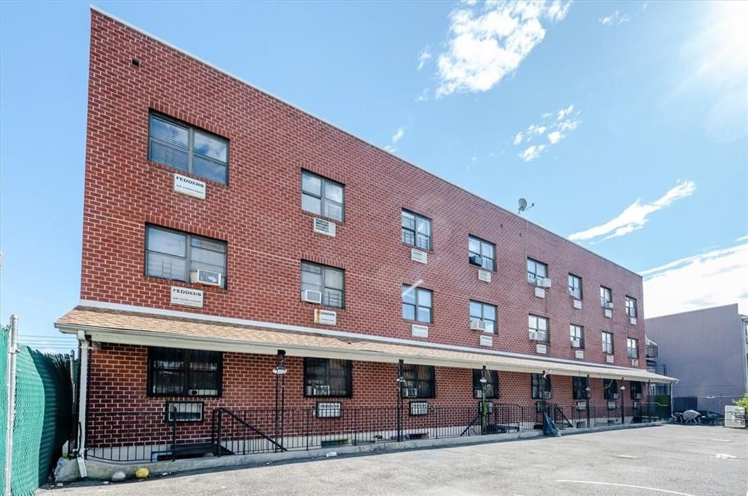 Exterior, Facade, Brick Facade, Condo Building