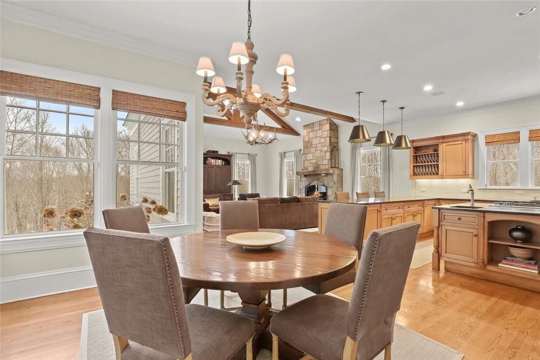 Chandelier, Dining room, Fireplace, Interior, Kitchen, Living room, Pendant Lights, Recessed Lighting, Wood Texture Flooring