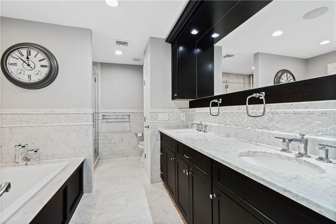 Bathroom, Dual Sink Vanities, Glass Shower, Interior, Marble, Recessed Lighting