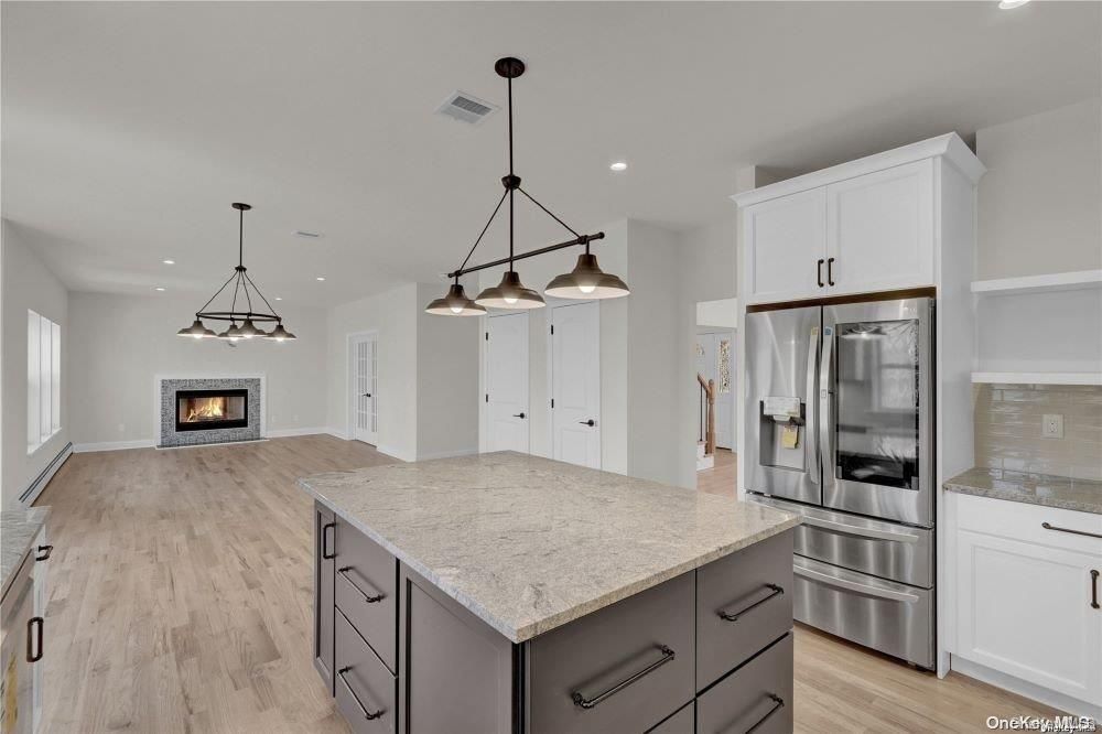 Fireplace, Interior, Kitchen, Pendant Lights, Recessed Lighting, Stainless Steel Appliances, Wood Texture Flooring