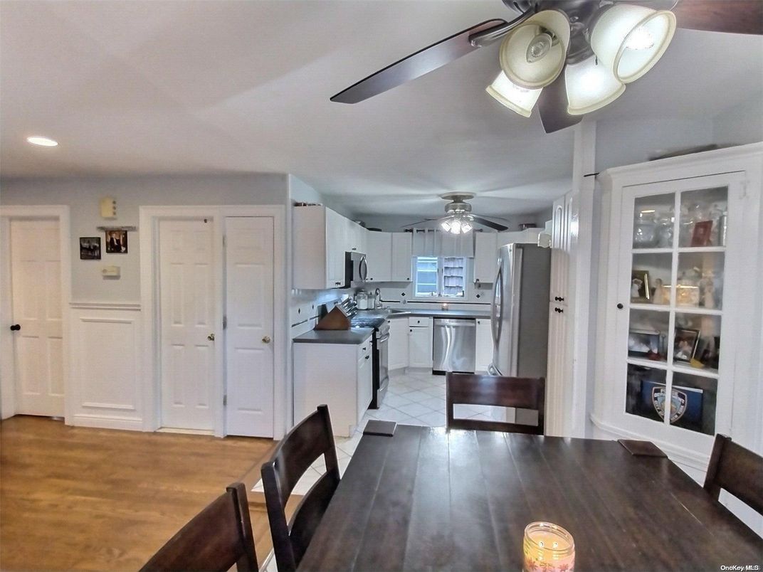 Dining room, Interior, Kitchen, Recessed Lighting, Stainless Steel Appliances, Wood Texture Flooring