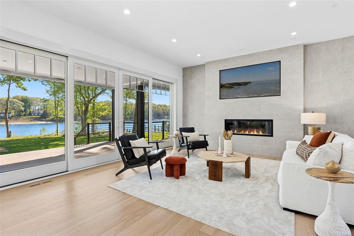 Fireplace, Interior, Living room, Recessed Lighting, Water, Wood Texture Flooring