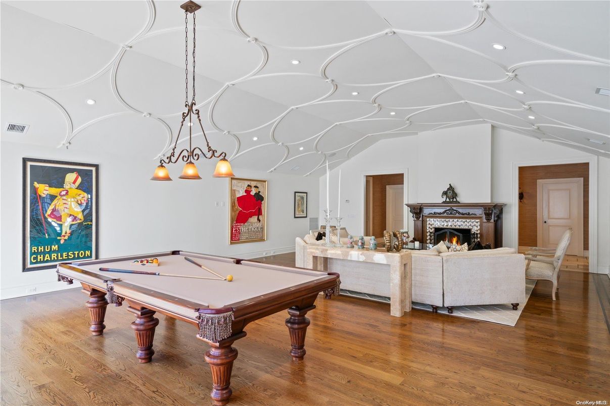 Billiard Table, Fireplace, Game Room, Interior, Living room, Pendant Lights, Recessed Lighting, Wood Texture Flooring