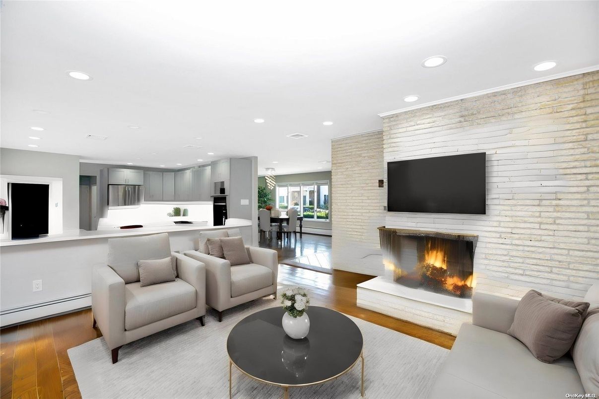 Dining room, Fireplace, Interior, Kitchen, Living room, Recessed Lighting, Stainless Steel Appliances, Stone Walls, Wood Texture Flooring