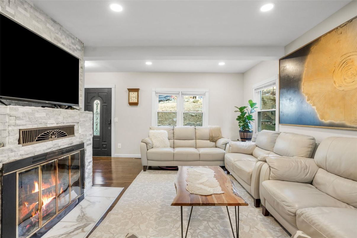 Fireplace, Interior, Living room, Marble, Recessed Lighting, Stone Walls, Wood Texture Flooring