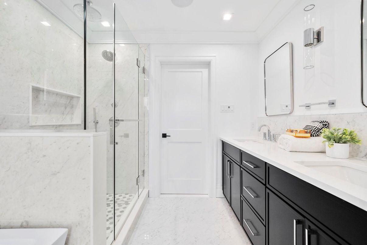 Bathroom, Dual Sink Vanities, Glass Shower, Interior, Marble, Marble Walls, Recessed Lighting