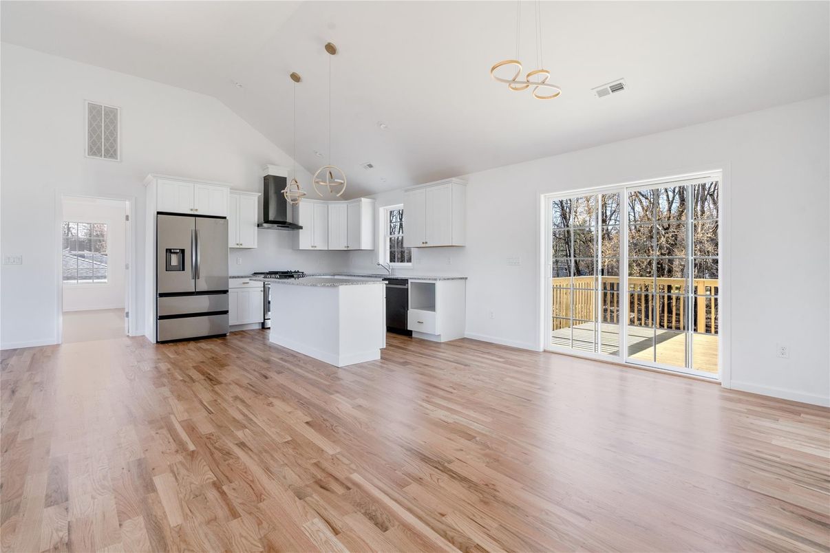 Empty room, Interior, Kitchen, Pendant Lights, Stainless Steel Appliances, Wood Texture Flooring