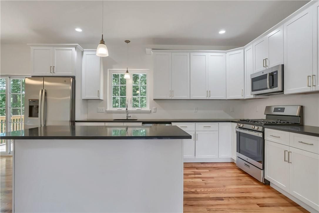 Interior, Kitchen, Pendant Lights, Recessed Lighting, Stainless Steel Appliances, Wood Texture Flooring