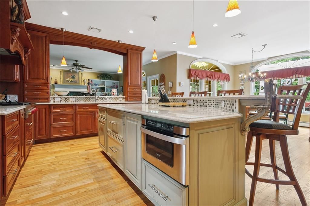 Chandelier, Dining room, Interior, Kitchen, Pendant Lights, Recessed Lighting, Stainless Steel Appliances, Wood Texture Flooring