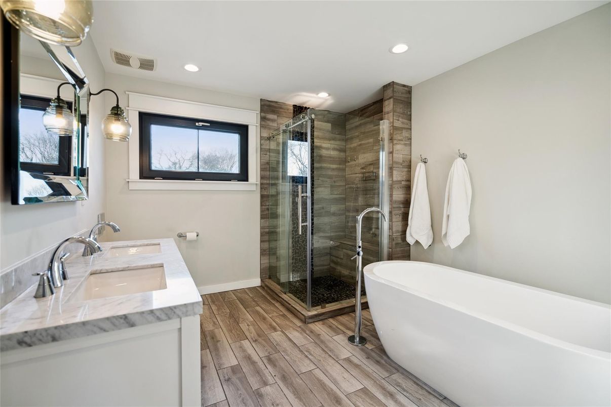 Bathroom, Dual Sink Vanities, Free Standing Baths, Glass Shower, Interior, Recessed Lighting, Wood Texture Flooring