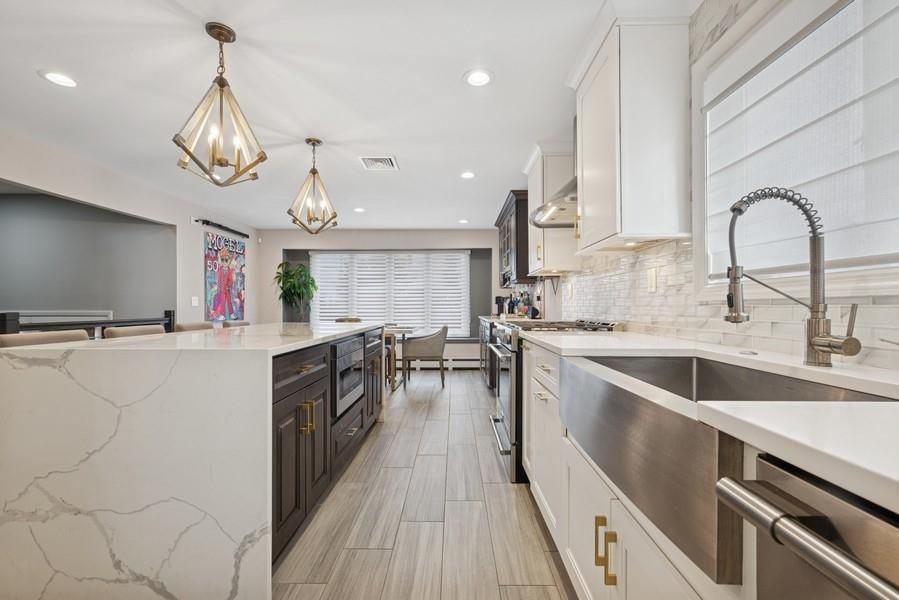 Dining room, Interior, Kitchen, Pendant Lights, Recessed Lighting, Stainless Steel Appliances, Wood Texture Flooring