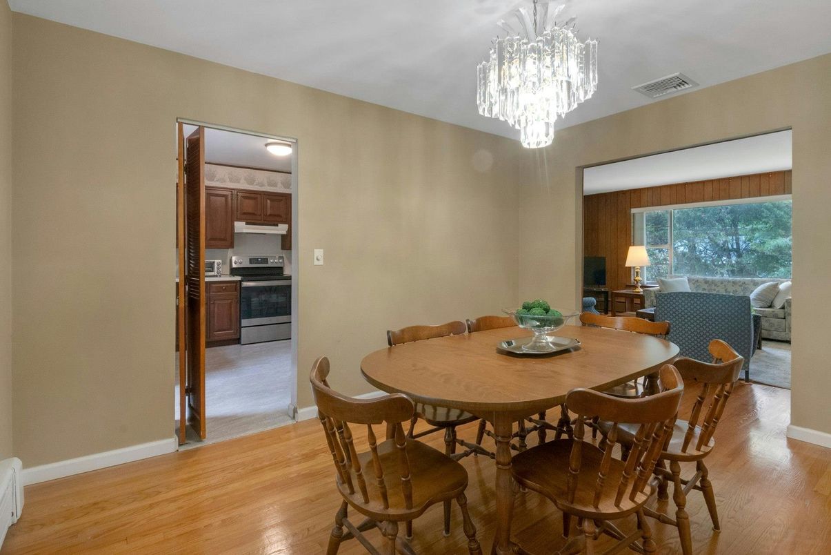 Chandelier, Dining room, Interior, Kitchen, Stainless Steel Appliances, Wood Texture Flooring