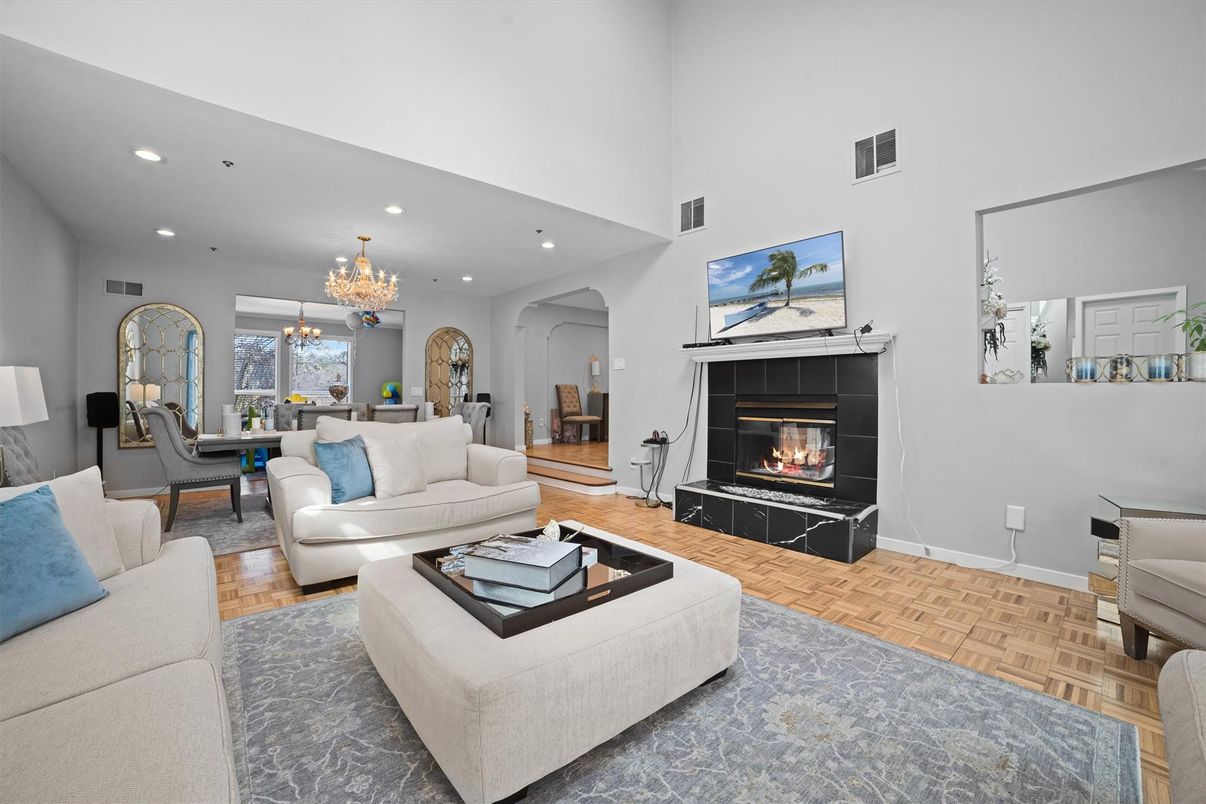 Chandelier, Dining room, Fireplace, Interior, Living room, Recessed Lighting, Wood Texture Flooring