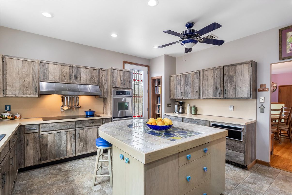 Interior, Kitchen, Recessed Lighting, Stainless Steel Appliances, Tile Countertops, Wood Texture Flooring