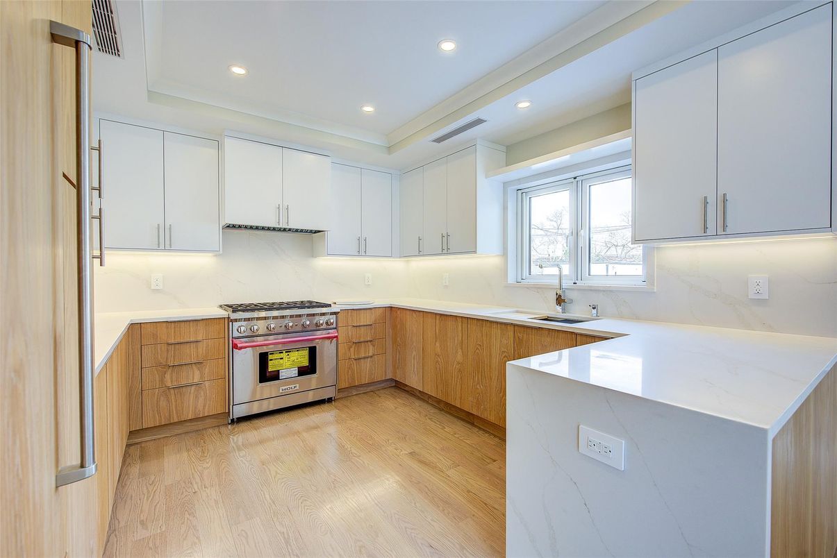 Interior, Kitchen, Marble Walls, Recessed Lighting, Stainless Steel Appliances, Wood Texture Flooring