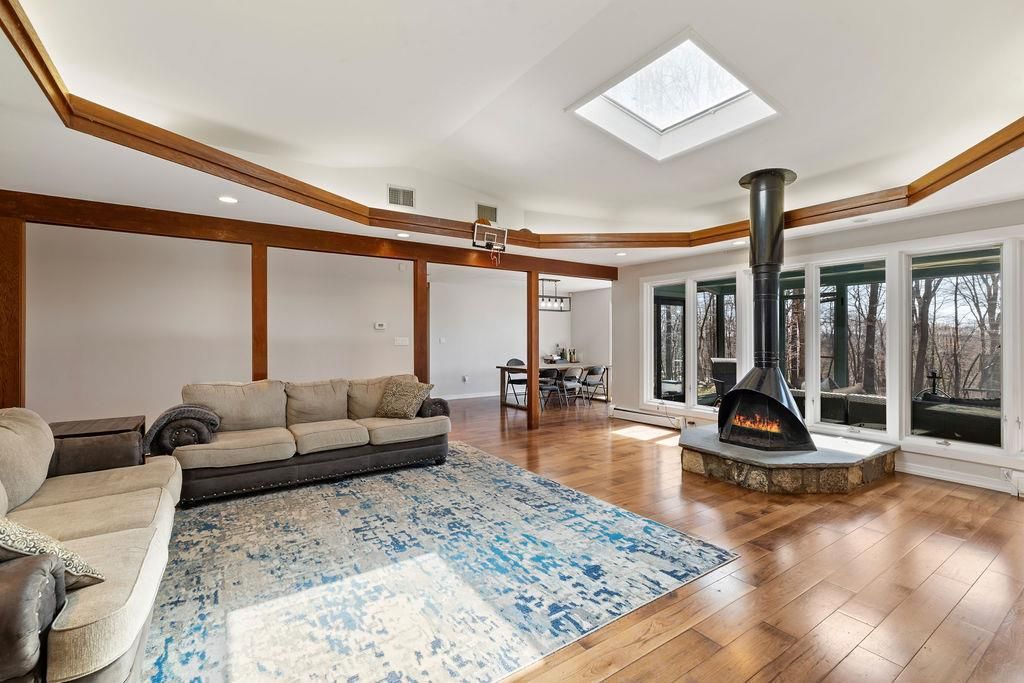Dining room, Fireplace, Interior, Living room, Recessed Lighting, Wood Texture Flooring