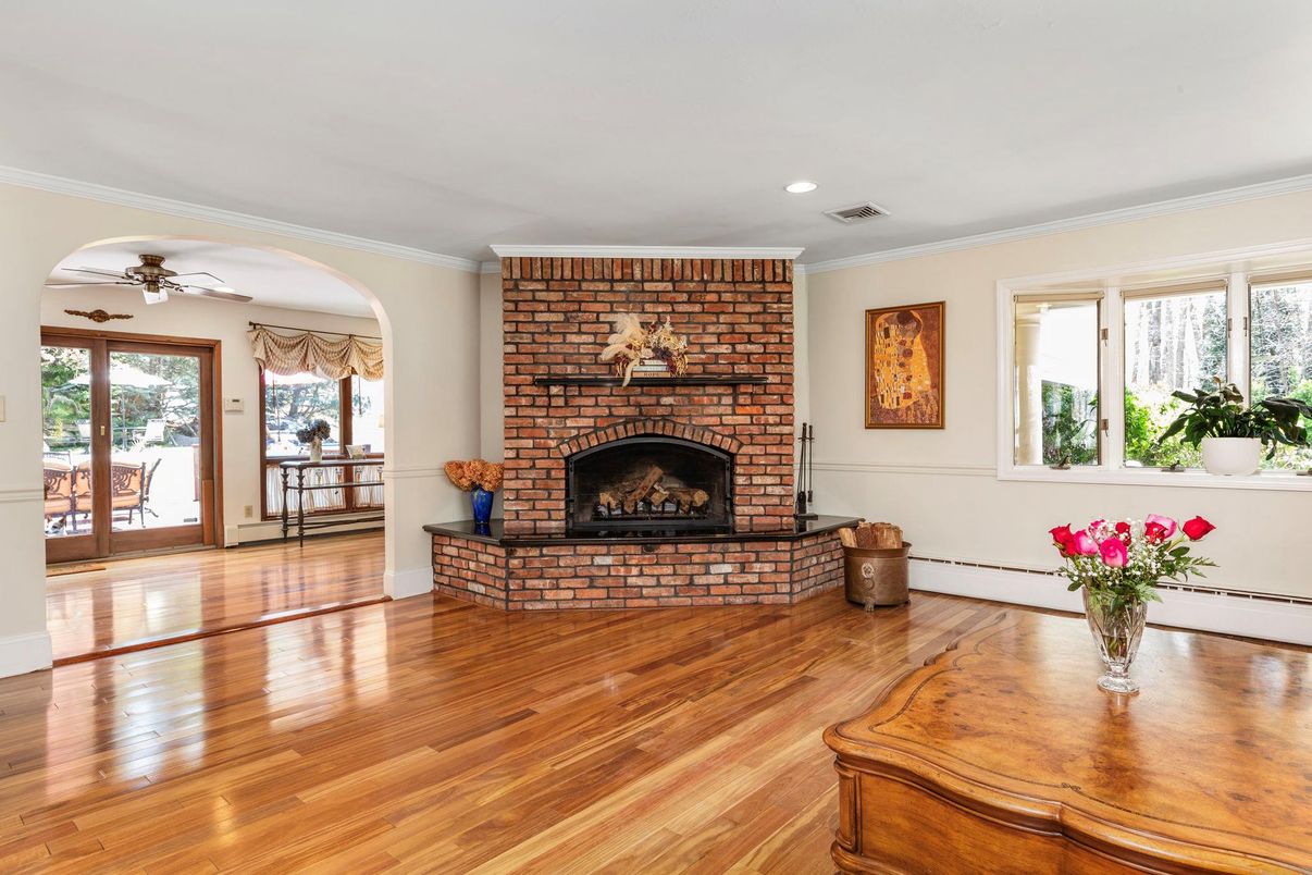 Empty room, Fireplace, Interior, Recessed Lighting, Stone Walls, Wood Texture Flooring