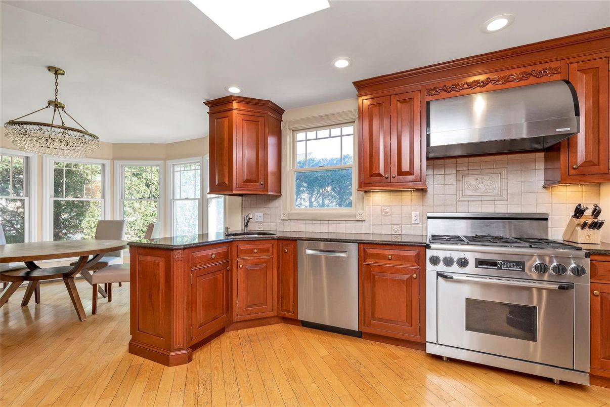 Dining room, Interior, Kitchen, Recessed Lighting, Stainless Steel Appliances, Wood Texture Flooring