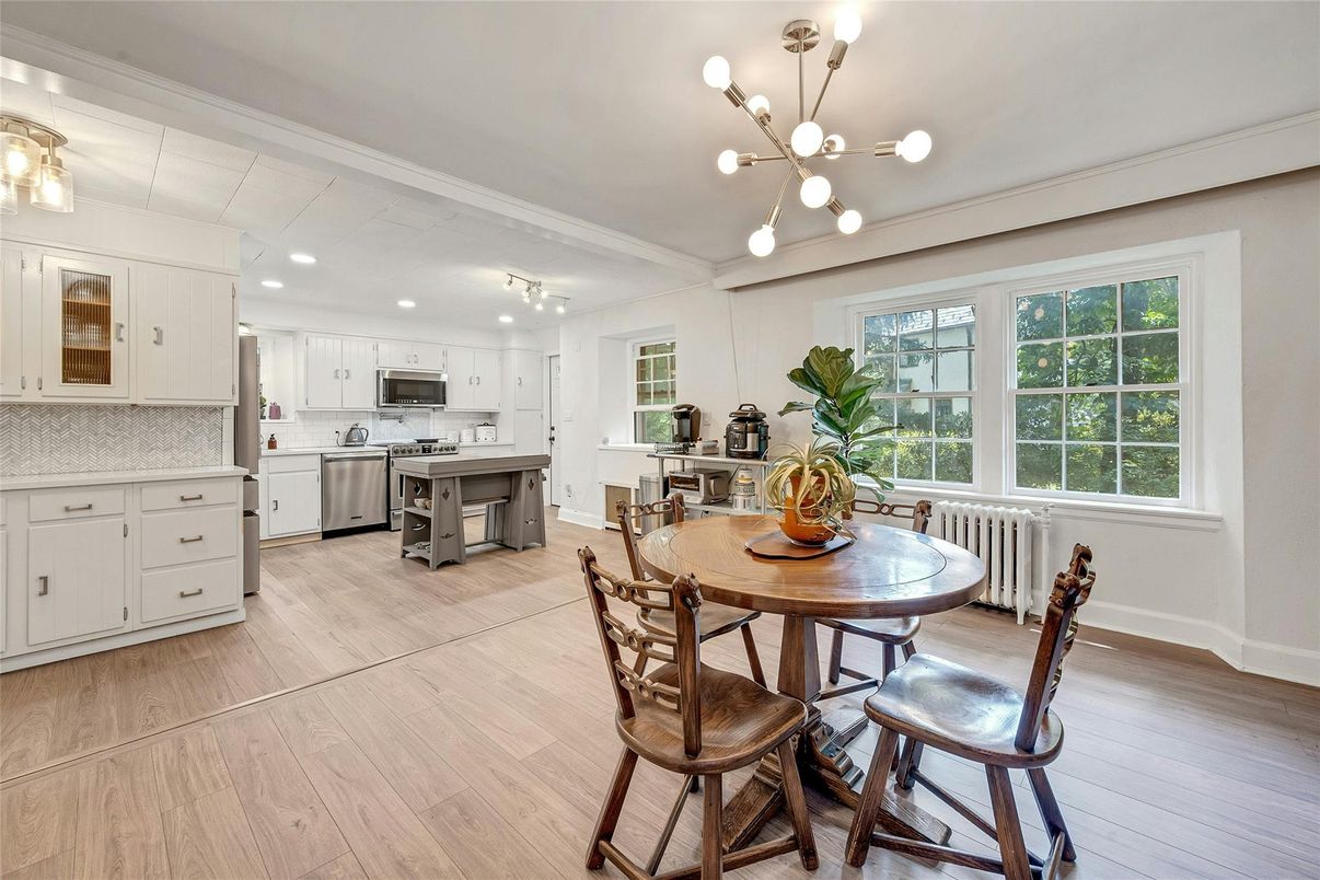 Dining room, Interior, Kitchen, Pendant Lights, Recessed Lighting, Stainless Steel Appliances, Wood Texture Flooring