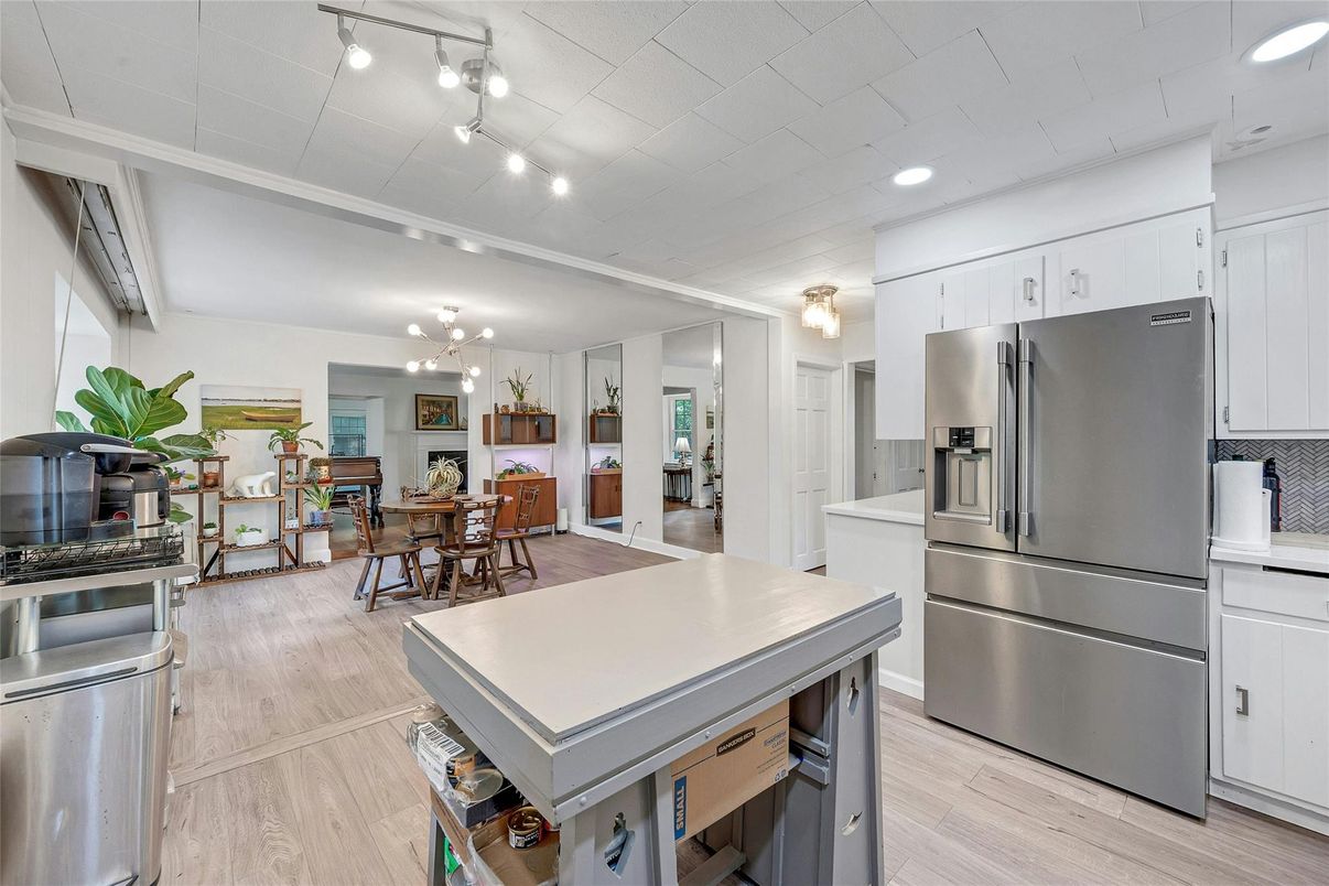 Dining room, Interior, Kitchen, Recessed Lighting, Stainless Steel Appliances, Wood Texture Flooring
