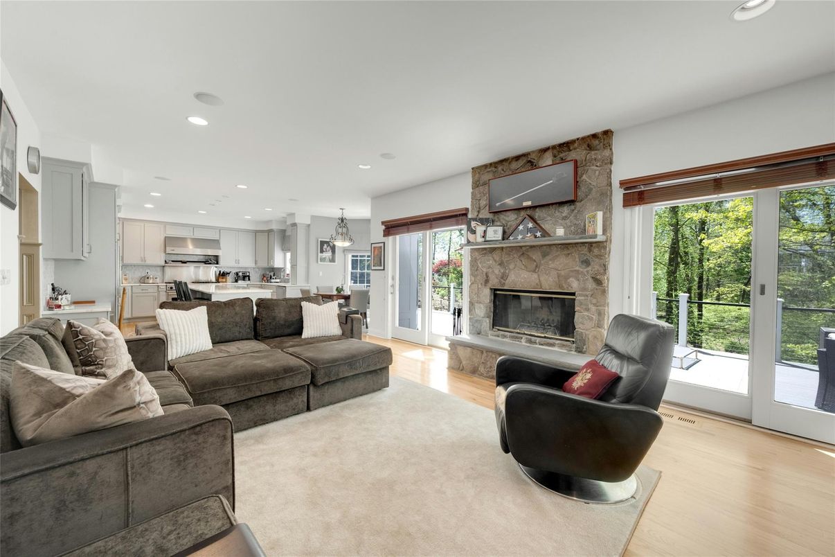 Fireplace, Interior, Kitchen, Living room, Pendant Lights, Recessed Lighting, Stainless Steel Appliances, Stone Walls, Wood Texture Flooring