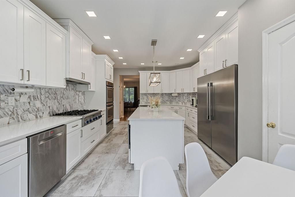 Interior, Kitchen, Marble, Marble Walls, Pendant Lights, Recessed Lighting, Stainless Steel Appliances