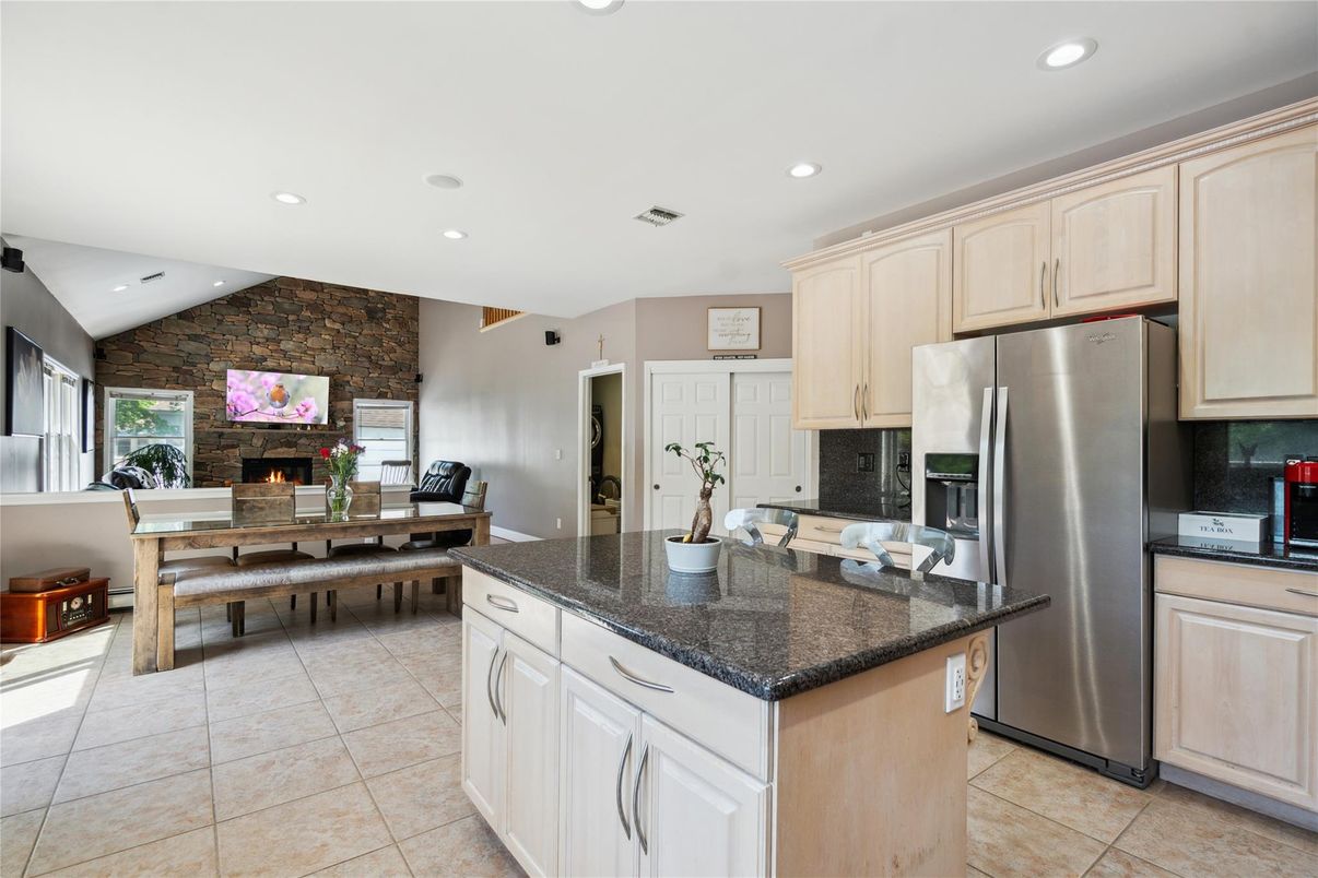 Dining room, Fireplace, Interior, Kitchen, Recessed Lighting, Stainless Steel Appliances, Stone Walls