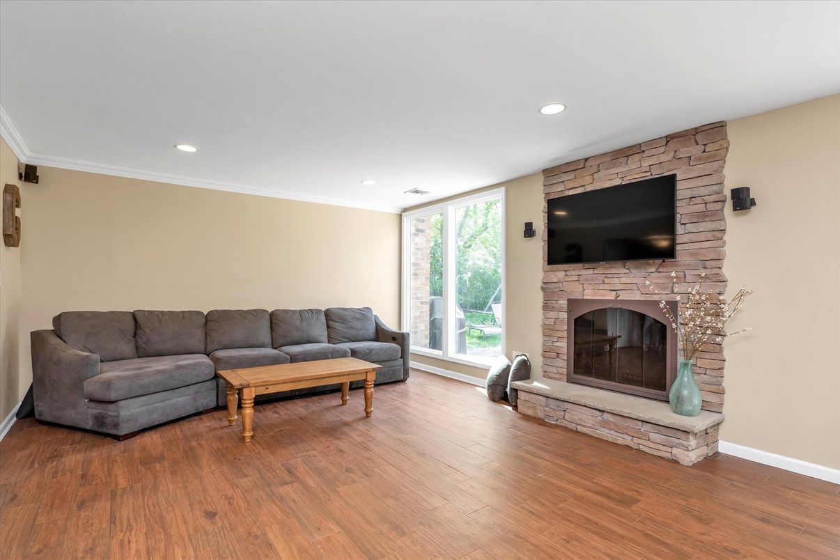 Fireplace, Interior, Living room, Recessed Lighting, Stone Walls, Wood Texture Flooring