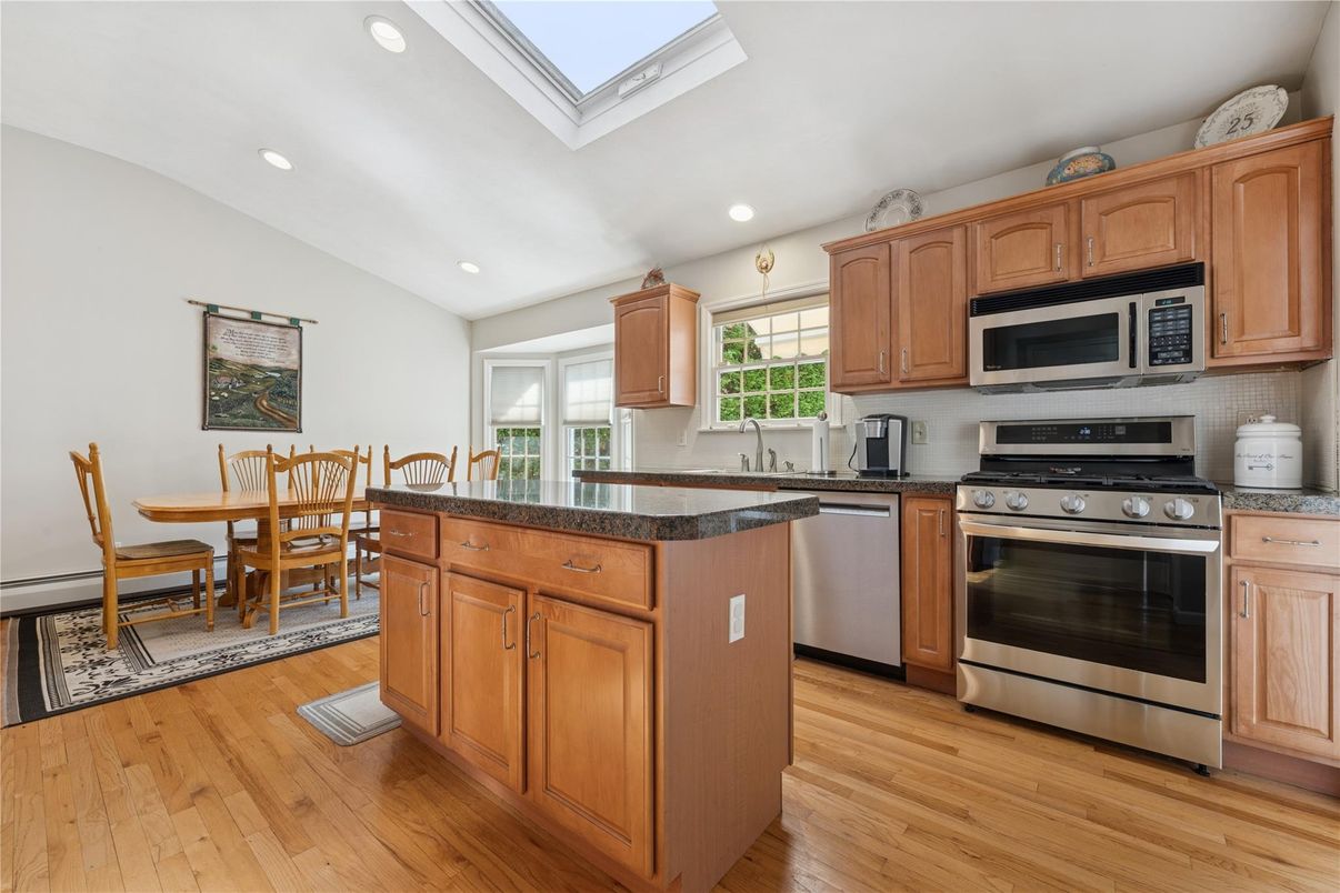 Dining room, Interior, Kitchen, Recessed Lighting, Stainless Steel Appliances, Wood Texture Flooring