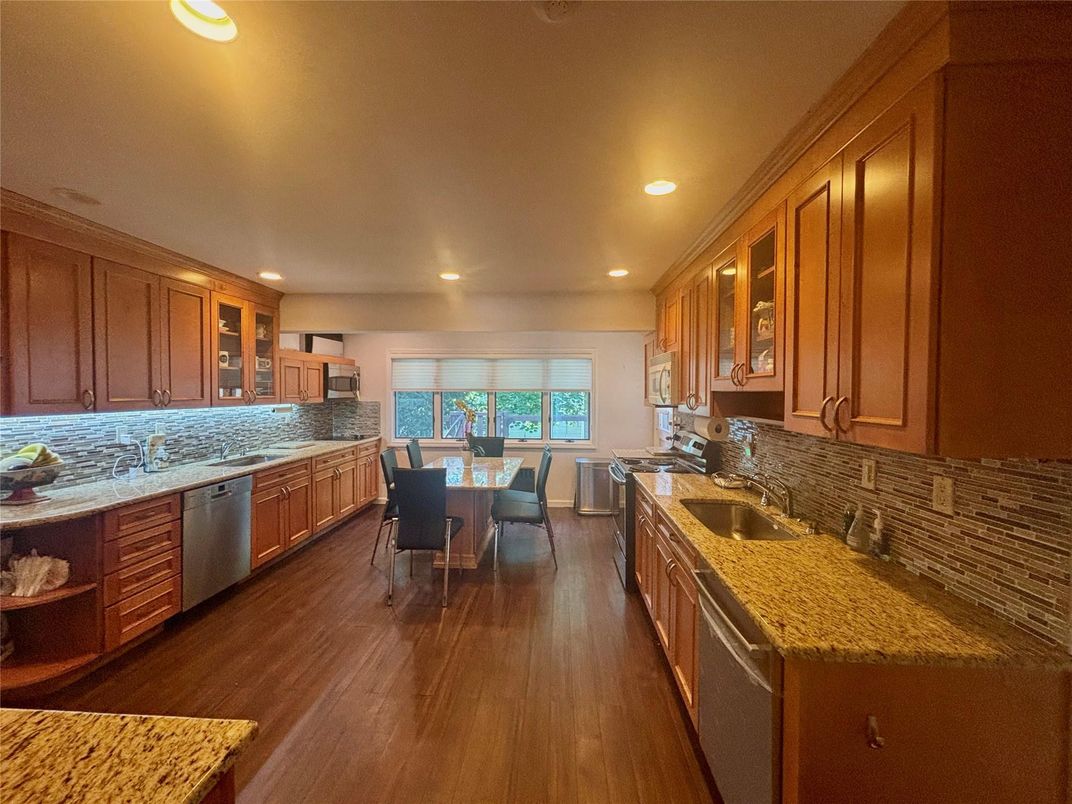 Dining room, Interior, Kitchen, Recessed Lighting, Stainless Steel Appliances, Wood Texture Flooring