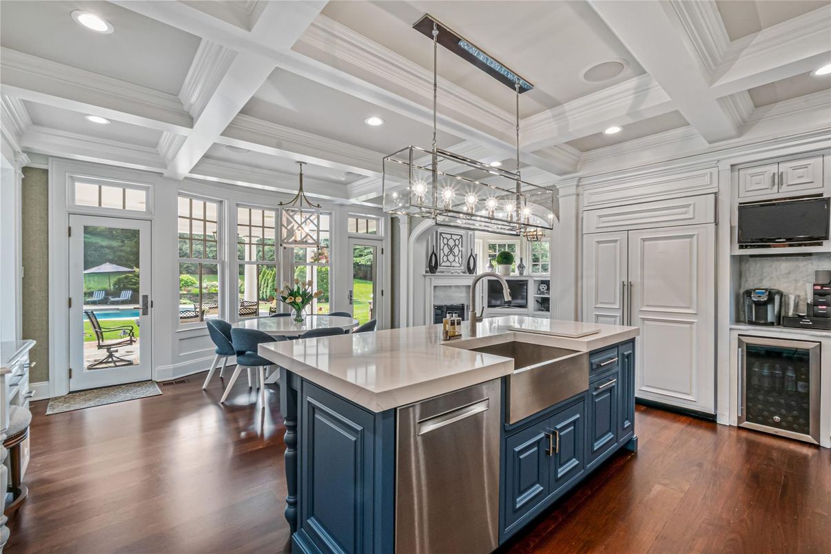 Chandelier, Dining room, Fireplace, Interior, Kitchen, Pendant Lights, Recessed Lighting, Stainless Steel Appliances, Wood Texture Flooring
