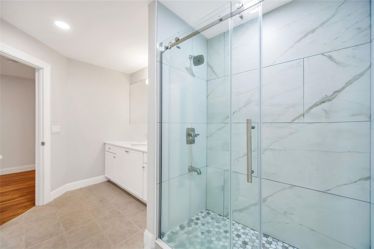 Bathroom, Glass Shower, Interior, Marble Walls, Recessed Lighting, Wood Texture Flooring
