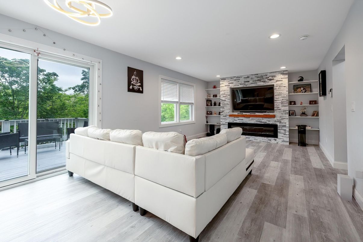 Fireplace, Interior, Living room, Pendant Lights, Recessed Lighting, Stone Walls, Wood Texture Flooring