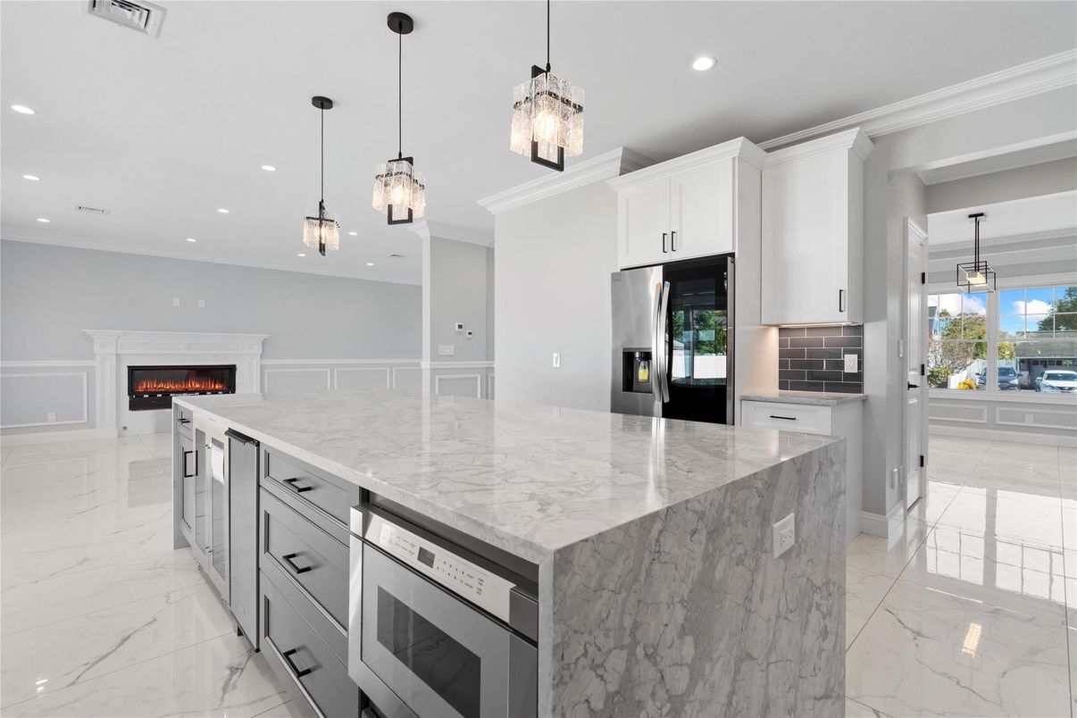 Fireplace, Interior, Kitchen, Marble, Pendant Lights, Recessed Lighting, Stainless Steel Appliances