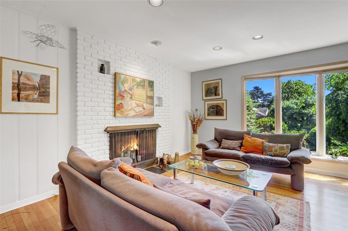 Fireplace, Interior, Living room, Recessed Lighting, Stone Walls, Wood Texture Flooring