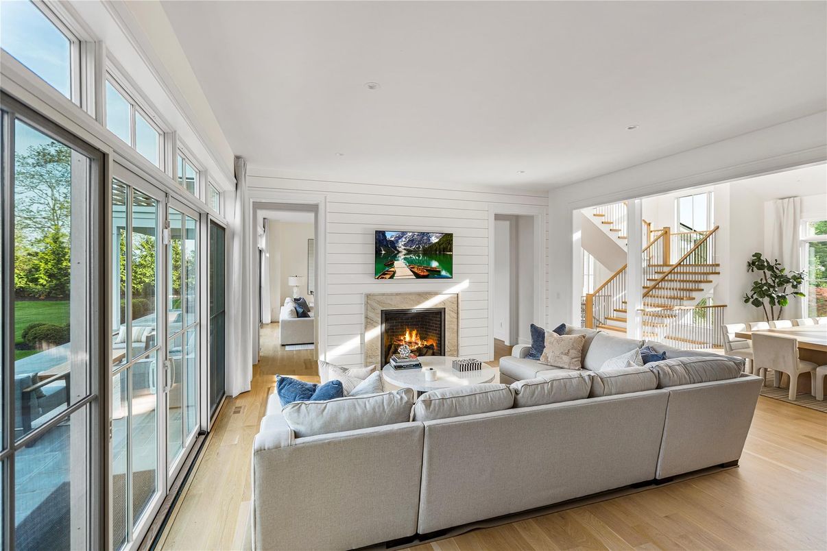 Fireplace, Interior, Living room, Recessed Lighting, Stone Walls, Wood Texture Flooring