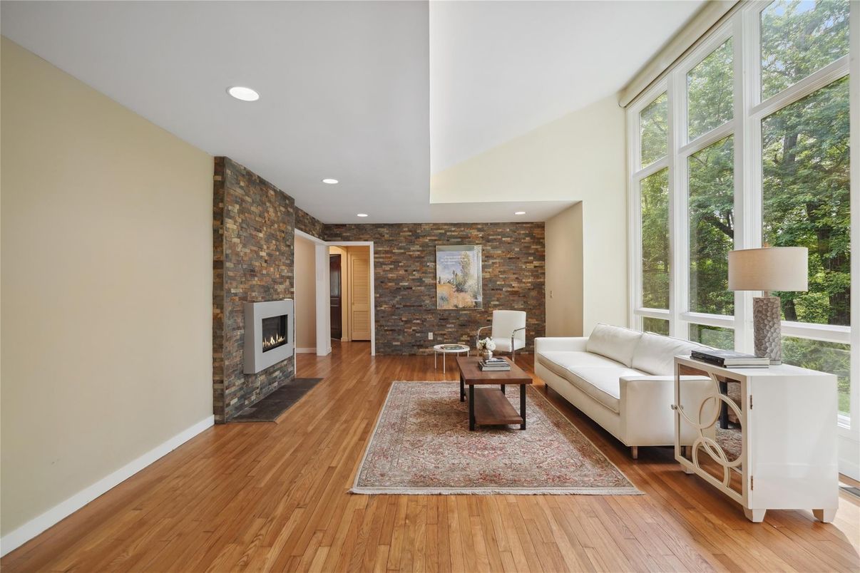 Fireplace, Interior, Living room, Recessed Lighting, Stone Walls, Wood Texture Flooring