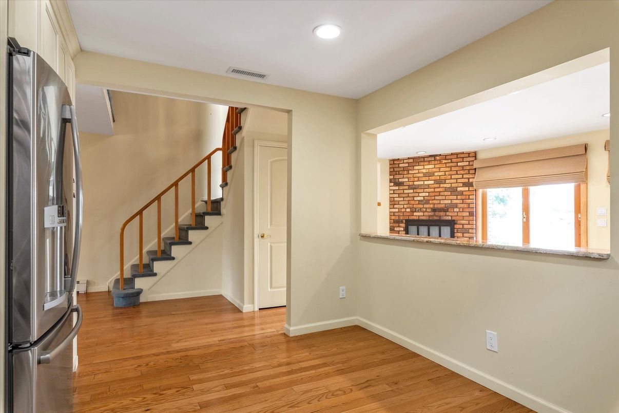 Empty room, Fireplace, Interior, Recessed Lighting, Stone Walls, Wood Texture Flooring