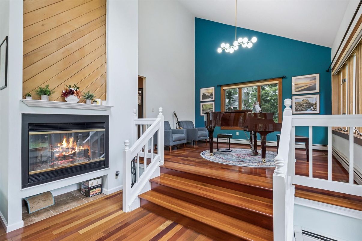 Dining room, Fireplace, Interior, Pendant Lights, Piano, Wood Texture Flooring