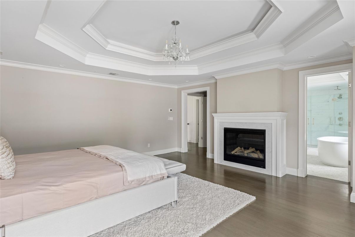 Bedroom, Chandelier, Fireplace, Interior, Recessed Lighting, Wood Texture Flooring
