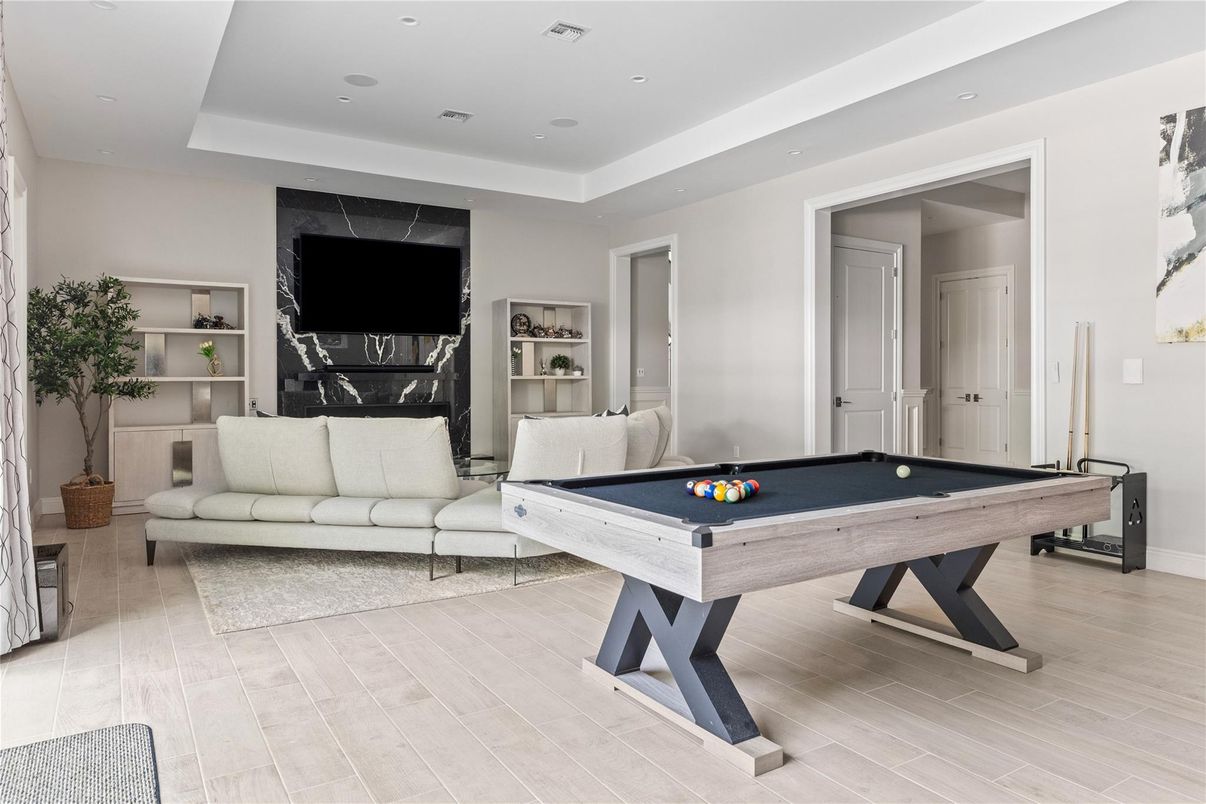 Billiard Table, Fireplace, Game Room, Interior, Living room, Recessed Lighting, Wood Texture Flooring