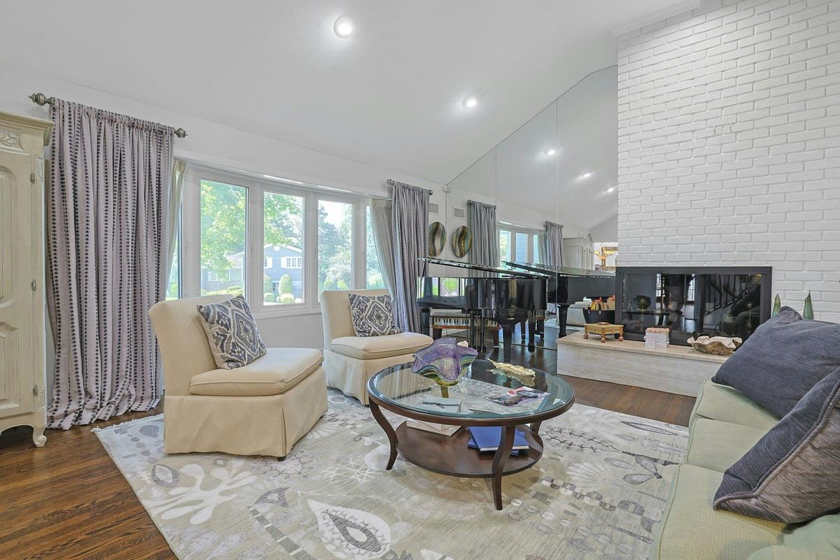Fireplace, Interior, Living room, Piano, Recessed Lighting, Stone Walls, Wood Texture Flooring