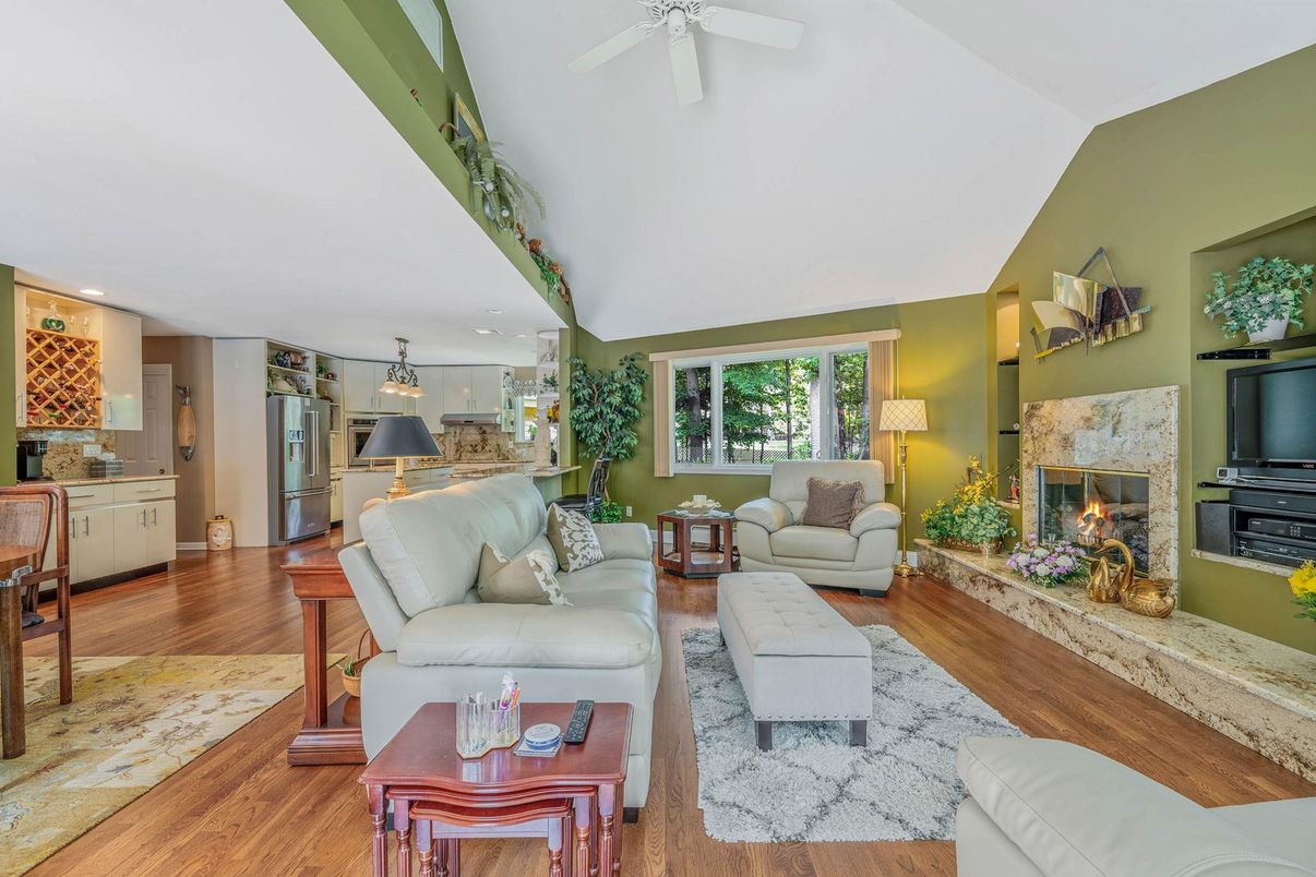 Fireplace, Interior, Kitchen, Living room, Pendant Lights, Recessed Lighting, Stainless Steel Appliances, Wood Texture Flooring