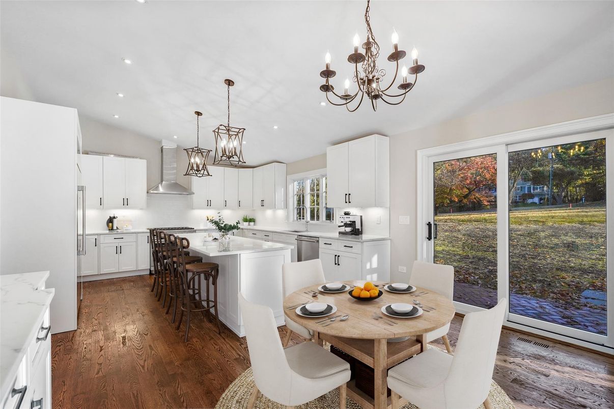 Chandelier, Dining room, Interior, Kitchen, Pendant Lights, Recessed Lighting, Stainless Steel Appliances, Wood Texture Flooring