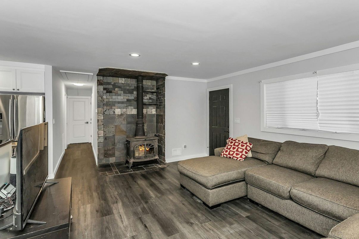 Fireplace, Interior, Living room, Recessed Lighting, Wood Texture Flooring