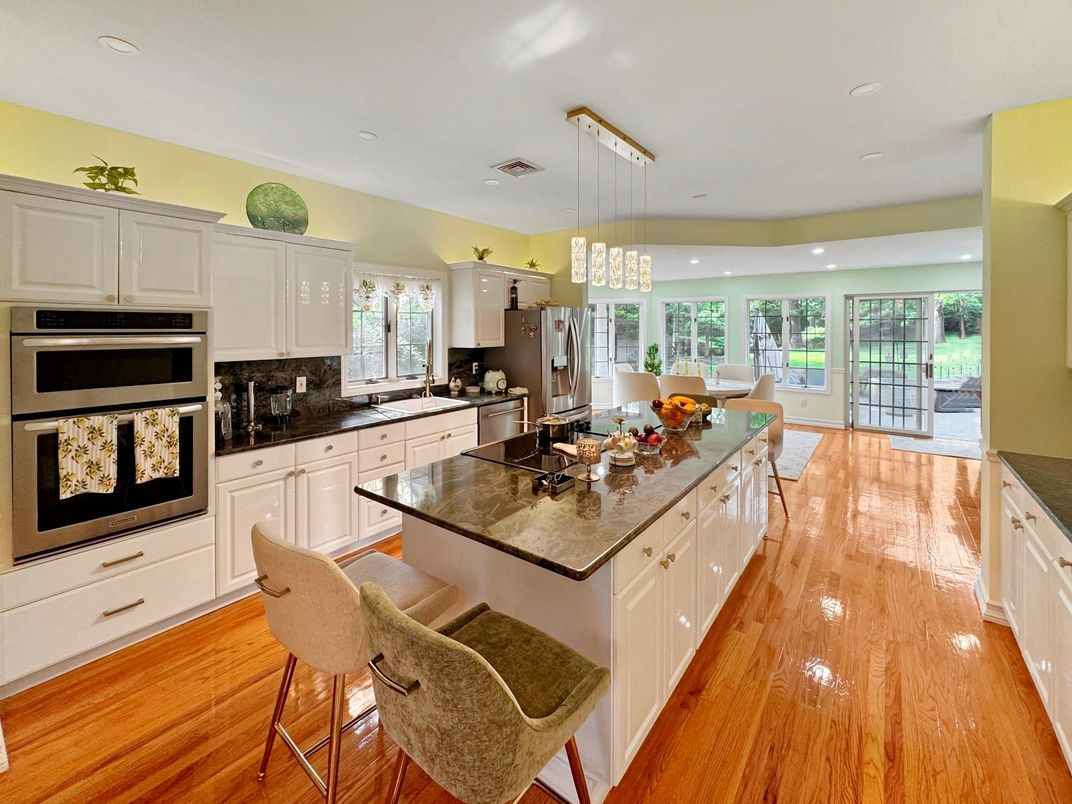 Dining room, Interior, Kitchen, Pendant Lights, Recessed Lighting, Stainless Steel Appliances, Wood Texture Flooring
