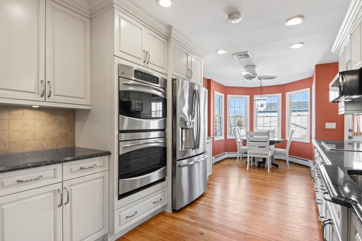 Dining room, Interior, Kitchen, Recessed Lighting, Stainless Steel Appliances, Wood Texture Flooring
