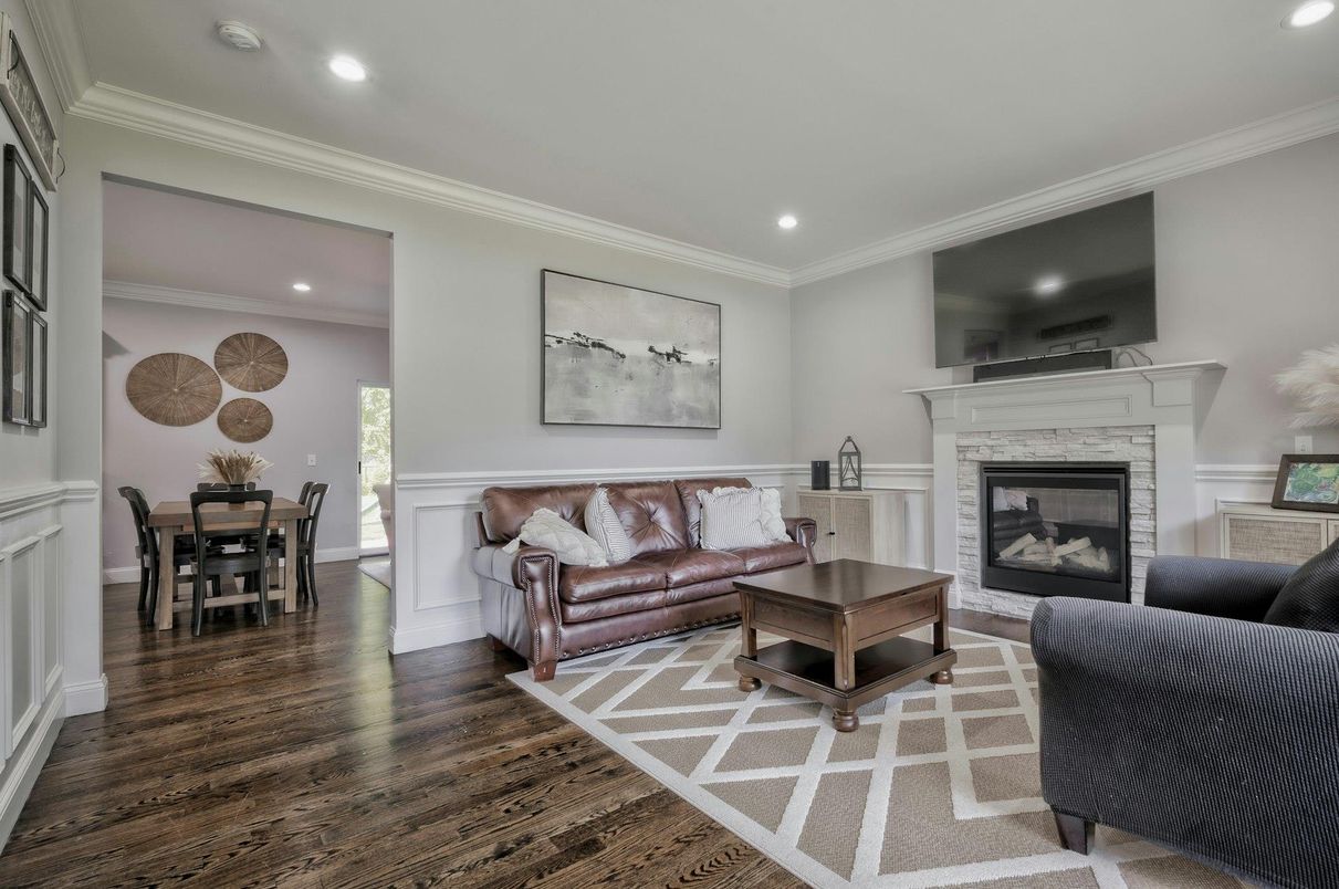 Dining room, Fireplace, Interior, Living room, Recessed Lighting, Wood Texture Flooring