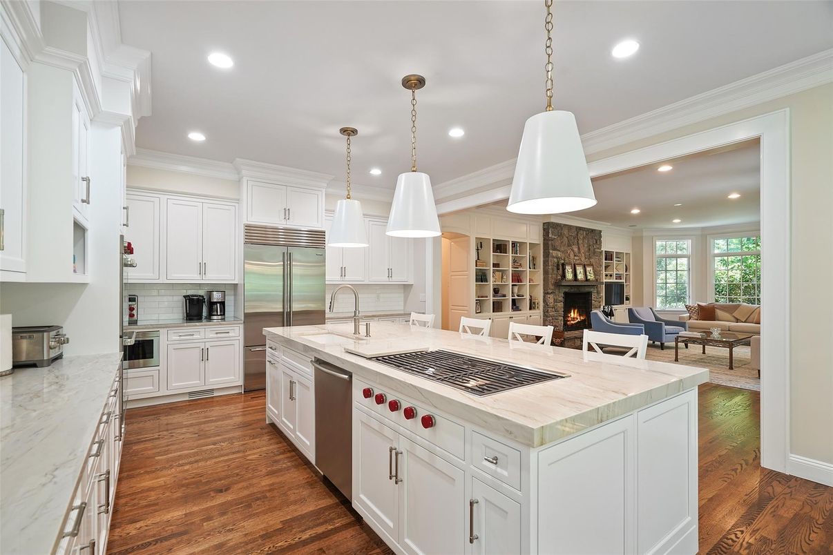Fireplace, Interior, Kitchen, Living room, Pendant Lights, Recessed Lighting, Stainless Steel Appliances, Wood Texture Flooring